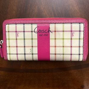 Beautiful Coach Zip around wallet with all leather interior and canvas outside.